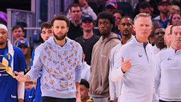 Golden State Warriors point guard Stephen Curry (left, center) gestures on the benchCredit: Kelley L Cox-USA TODAY Sports