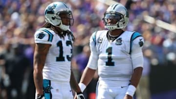 Sep 28, 2014; Baltimore, MD, USA; Carolina Panthers quarterback Cam Newton (1) and wide receiver Kelvin Benjamin (13) during a break in action against the Baltimore Ravens at M&T Bank Stadium. Mandatory Credit: Mitch Stringer-USA TODAY Sports