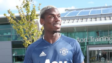 MANCHESTER, ENGLAND - AUGUST 08: (EXCLUSIVE COVERAGE) Paul Pogba of Manchester United poses after signing for the club at Aon Training Complex on August 8, 2016 in Manchester, England. (Photo by John Peters/Man Utd via Getty Images)