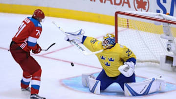 Sep 18, 2016; Toronto, Ontario, Canada; Team Sweden Goaltender Jacob Markstrom (25) makes a save against Team Russia Center Evgeni Malkin (71) in the third period during preliminary round play in the 2016 World Cup of Hockey at Air Canada Centre. Sweden won 2-1. Mandatory Credit: Kevin Sousa-USA TODAY Sports