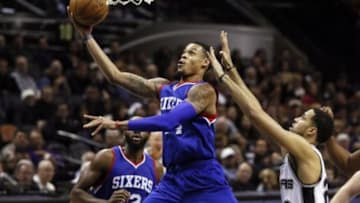 Nov 17, 2014; San Antonio, TX, USA; Philadelphia 76ers shooting guard K.J. McDaniels (left) shoots the ball past San Antonio Spurs small forward Austin Daye (right) during the second half at AT&T Center. The Spurs won 100-75. Mandatory Credit: Soobum Im-USA TODAY Sports