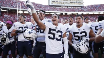 MADISON, WI - SEPTEMBER 15: Isaiah Kaufusi #53 of the BYU Cougars celebrates with teammates after the game against the Wisconsin Badgers at Camp Randall Stadium on September 15, 2018 in Madison, Wisconsin. BYU won 24-21. (Photo by Joe Robbins/Getty Images)