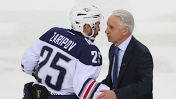 KAZAN, RUSSIA - MARCH 30, 2017: Ak Bars's head coach Zinetula Bilyaletdinov (R) and player Danis Zaripov in Leg 4 of their 2016/17 Season Kontinental Hockey League Eastern Conference final playoff tie with Metallurg Magnitogorsk at Tatneft Arena. Metallurg Magnitogorsk won the game 1-4. Yegor Aleyev/TASS (Photo by Yegor Aleyev\TASS via Getty Images)