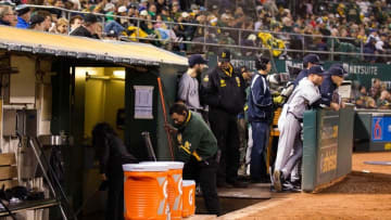 May 20, 2016; Oakland, CA, USA; Stadium staff mop up outside the visiting New York Yankees dugout bathroom during the sixth inning Oakland Athletics at the Oakland Coliseum. Mandatory Credit: Kelley L Cox-USA TODAY Sports