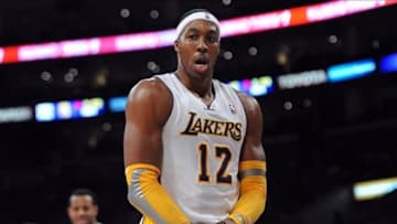 January 6, 2013; Los Angeles, CA, USA; Los Angeles Lakers center Dwight Howard (12) questions a foul call during the first half of the game against the Denver Nuggets at the Staples Center. Mandatory Credit: Jayne Kamin-Oncea-USA TODAY Sports