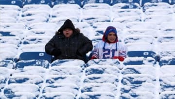Dec. 30, 2012; Orchard Park, NY, USA; Fans sit in the snow covered seats before a game between the Buffalo Bills and the New York Jets at Ralph Wilson Stadium. Mandatory Credit: Timothy T. Ludwig-USA TODAY Sports