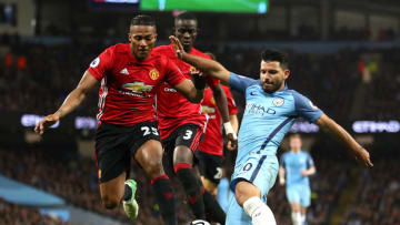 MANCHESTER, ENGLAND - APRIL 27: Antonio Valencia of Manchester United puts pressure on Sergio Aguero of Manchester City during the Premier League match between Manchester City and Manchester United at Etihad Stadium on April 27, 2017 in Manchester, England. (Photo by Clive Brunskill/Getty Images)