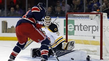 Oct 26, 2016; New York, NY, USA; Boston Bruins goalie Zane McIntyre (31) makes a save against New York Rangers right wing Rick Nash (61) during the second period at Madison Square Garden. Nash scored on the rebound. Mandatory Credit: Adam Hunger-USA TODAY Sports