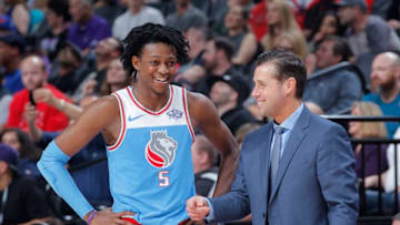 SACRAMENTO, CA - FEBRUARY 5: Head coach Dave Joerger of the Sacramento Kings talks with De'Aaron Fox