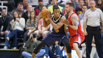 Dec 26, 2015; Salt Lake City, UT, USA; Utah Jazz guard Rodney Hood (5) holds the ball defended by Los Angeles Clippers guard J.J. Redick (4) during NBA action at Vivint Smart Home Arena. Mandatory Credit: Rob Gray-USA TODAY Sports