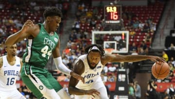 LAS VEGAS, NV - JULY 06: Isaiah Miles #41 of the Philadelphia 76ers drives against Robert Williams III #44 of the Boston Celtics during the 2018 NBA Summer League at the Thomas & Mack Center on July 6, 2018 in Las Vegas, Nevada. The Celtics defeated the 76ers 69-63. NOTE TO USER: User expressly acknowledges and agrees that, by downloading and or using this photograph, User is consenting to the terms and conditions of the Getty Images License Agreement. (Photo by Ethan Miller/Getty Images)