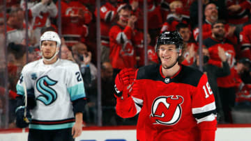 Dawson Mercer #18 of the New Jersey Devils celebrates his first NHL goal at 5:02 of the first period against the Seattle Kraken at the Prudential Center on October 19, 2021 in Newark, New Jersey. (Photo by Bruce Bennett/Getty Images)
