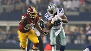 Oct 13, 2013; Arlington, TX, USA; Dallas Cowboys running back DeMarco Murray (29) runs with the ball against Washington Redskins linebacker Perry Riley Jr. (56).