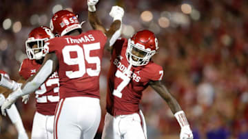 Oklahoma's Latrell McCutchin (7) and Isaiah Thomas (95) celebrate after a play during a college football game between the University of Oklahoma Sooners (OU) and the Western Carolina Catamounts at Gaylord Family-Oklahoma Memorial Stadium in Norman, Okla., Saturday, Sept. 11, 2021.Lx17230