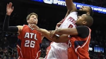 Jan 19, 2015; Atlanta, GA, USA; Detroit Pistons center Andre Drummond (0) shoots the ball between Atlanta Hawks guard Kyle Korver (26) and center Al Horford (15) during the first half at Philips Arena. Mandatory Credit: Dale Zanine-USA TODAY Sports