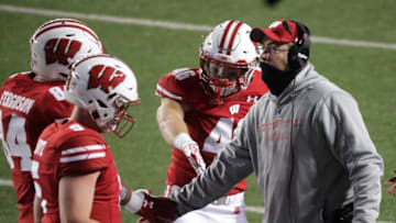 Wisconsin head coach Paul Chryst congratulates his team after a touchdown against Illinois on Oct. 23.Uwgrid24 4