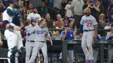 SEATTLE, WA - AUGUST 18: Manny Machado #8 and Matt Kemp #27 celebrate a solo home run by Max Muncy #13 of the Los Angeles Dodgers to tie the game 4-4 in the ninth inning against the Seattle Mariners during their game at Safeco Field on August 18, 2018 in Seattle, Washington. (Photo by Abbie Parr/Getty Images)