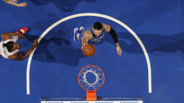 Photo by Tom O'Connor/NBAE via Getty Images   Stephen M. Dowell/Orlando Sentinel/TNS via Getty Images