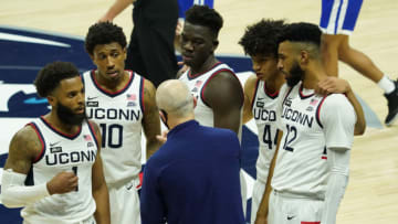 Nov 25, 2020; Storrs, CT, USA; Connecticut Huskies head coach Dan Hurley talks to guard R.J. Cole (1) and guard Brendan Adams (10) and forward Adama Sanogo (middle top) and guard Andre Jackson (44) and forward Tyler Polley (12) during a break in the action against the Central Connecticut State Blue Devils in the second half at Gampel Pavilion. Mandatory Credit: David Butler II-USA TODAY Sports