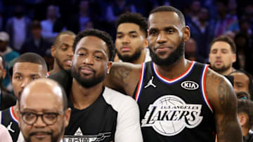 CHARLOTTE, NORTH CAROLINA - FEBRUARY 17: Dwyane Wade #3 of the Miami Heat and LeBron James #23 of the Los Angeles Lakers both of Team LeBron look on during the trophy presentation ceremony after their 178-164 win over Team Giannis during the NBA All-Star game as part of the 2019 NBA All-Star Weekend at Spectrum Center on February 17, 2019 in Charlotte, North Carolina. NOTE TO USER: User expressly acknowledges and agrees that, by downloading and/or using this photograph, user is consenting to the terms and conditions of the Getty Images License Agreement. Mandatory Copyright Notice: Copyright 2019 NBAE (Photo by Streeter Lecka/Getty Images)