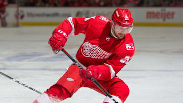 DETROIT, MI - FEBRUARY 24: Tomas Tatar #21 of the Detroit Red Wings stops with the puck against the Carolina Hurricanes during an NHL game at Little Caesars Arena on February 24, 2018 in Detroit, Michigan. The Wings defeated the Hurricanes 3-1. (Photo by Dave Reginek/NHLI via Getty Images)