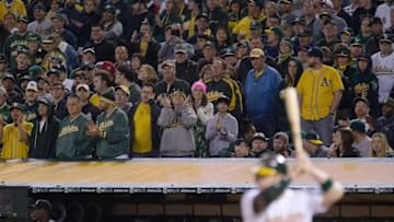 Apr 4, 2016; Oakland, CA, USA; Oakland Athletics fans watch as catcher Stephen Vogt (21) bats against the Chicago White Sox during the ninth inning at the Oakland Coliseum. The White Sox defeated the Athletics 4-3. Mandatory Credit: Kelley L Cox-USA TODAY Sports