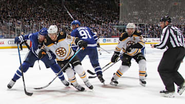 David Pastrnak #88 of the Boston Bruins battles against Jake Muzzin #8 of the Toronto Maple Leafs in Game Three of the Eastern Conference First Round during the 2019 NHL Stanley Cup Playoffs at Scotiabank Arena. (Photo by Claus Andersen/Getty Images)