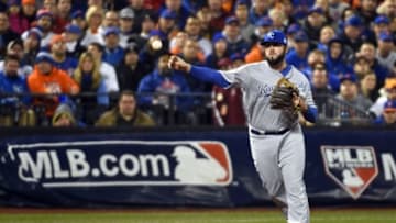 Oct 31, 2015; New York City, NY, USA; Kansas City Royals third baseman Mike Moustakas throws to first base against the New York Mets in the second inning in game four of the World Series at Citi Field. Mandatory Credit: Robert Deutsch-USA TODAY Sports