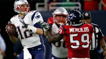 Dec 13, 2015; Houston, TX, USA; New England Patriots quarterback Tom Brady (12) throws over Houston Texans outside linebacker Whitney Mercilus (59) during the first quarter at NRG Stadium. Mandatory Credit: Kevin Jairaj-USA TODAY Sports