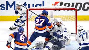 Anders Lee #27 of the New York Islanders and Zach Bogosian #24 of the Tampa Bay Lightning (Photo by Bruce Bennett/Getty Images)