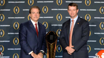 SCOTTSDALE, AZ - JANUARY 10: Head coach Nick Saban of the Alabama Crimson Tide (L) and head coach Dabo Swinney of the Clemson Tigers pose for a photo next to the National Championship trophy during the Head Coach Press Conference for the College Football Playoff National Championship at JW Marriott Scottsdale Camelback Inn on January 10, 2016 in Scottsdale, Arizona. (Photo by Jennifer Stewart/Getty Images)