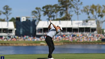 PONTE VEDRA BEACH, FLORIDA - MARCH 14: Rory McIlroy of Northern Ireland plays his shot from the 17th tee during the first round of The PLAYERS Championship on The Stadium Course at TPC Sawgrass on March 14, 2019 in Ponte Vedra Beach, Florida. (Photo by Mike Ehrmann/Getty Images)