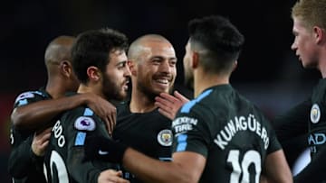 SWANSEA, WALES - DECEMBER 13: Manchester City goalscorer David Silva (c) celebrates his opening goal with team mates during the Premier League match between Swansea City and Manchester City at Liberty Stadium on December 13, 2017 in Swansea, Wales. (Photo by Stu Forster/Getty Images)