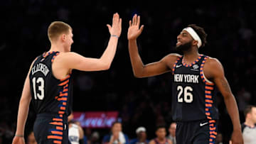 NEW YORK, NEW YORK - FEBRUARY 26: Henry Ellenson #13 of the New York Knicks and Mitchell Robinson #26 react during the second half of the game against the Orlando Magic at Madison Square Garden on February 26, 2019 in New York City. The New York Knicks defeat the Orlando Magic 108-103. NOTE TO USER: User expressly acknowledges and agrees that, by downloading and or using this photograph, User is consenting to the terms and conditions of the Getty Images License Agreement. (Photo by Sarah Stier/Getty Images)