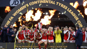 Arsenal's Irish striker Katie McCabe (C) holds the trophy as she celebrtates with teammates after winning the English Women's League Cup final football match between Arsenal and Chelsea at Selhurst Park in south London on March 5, 2023. (Photo by ADRIAN DENNIS / AFP) / RESTRICTED TO EDITORIAL USE. No use with unauthorized audio, video, data, fixture lists, club/league logos or 'live' services. Online in-match use limited to 120 images. An additional 40 images may be used in extra time. No video emulation. Social media in-match use limited to 120 images. An additional 40 images may be used in extra time. No use in betting publications, games or single club/league/player publications. / (Photo by ADRIAN DENNIS/AFP via Getty Images)