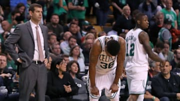 BOSTON, MA - MAY 27: As the final seconds tick off the clock, the Celtics (left to right) head coach Brad Stevens, Marcus Smart and Terry Rozier II react. The Boston Celtics hosted the Cleveland Cavaliers for Game Seven of their NBA Eastern Conference Finals playoff series at TD Garden in Boston on May 27, 2018. (Photo by Jim Davis/The Boston Globe via Getty Images)