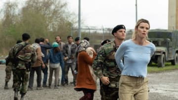 Crystal (Betty Gilpin, right) with a border agent (Yosef Kasnetzkov) and refugees in "The Hunt," directed by Craig Zobel.