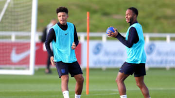 BURTON-UPON-TRENT, ENGLAND - OCTOBER 11: Jadon Sancho of England and Raheem Sterling of England train during the England Training Session at St Georges Park on October 11, 2018 in Burton-upon-Trent, England. (Photo by Catherine Ivill/Getty Images)