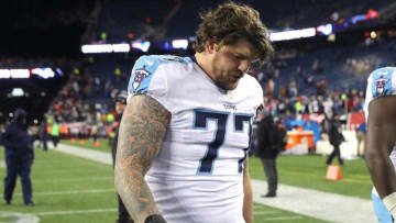 FOXBOROUGH, MA - JANUARY 13: Taylor Lewan #77 of the Tennessee Titans reacts after the AFC Divisional Playoff game against the New England Patriots at Gillette Stadium on January 13, 2018 in Foxborough, Massachusetts. (Photo by Elsa/Getty Images)