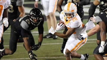 Tennessee running back Jabari Small (20) rushes for a first down during the first quarter at Vanderbilt Stadium Saturday, Dec. 12, 2020 in Nashville, Tenn.Gw56179