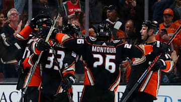 ANAHEIM, CA - APRIL 14: Brandon Montour #26, Jakob Silfverberg #33, and Ryan Getzlaf #15 of the Anaheim Ducks celebrate a second period goal in Game Two of the Western Conference First Round against the San Jose Sharks during the 2018 NHL Stanley Cup Playoffs at Honda Center on April 14, 2018 in Anaheim, California. (Photo by Debora Robinson/NHLI via Getty Images)