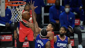 Dec 30, 2020; Los Angeles, California, USA; Portland Trail Blazers guard CJ McCollum (3) drives to the basket between LA Clippers forward Kawhi Leonard (2) and guard Paul George (13) in the first quarter at Staples Center. Mandatory Credit: Robert Hanashiro-USA TODAY Sports