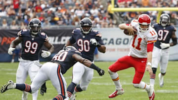 Aug 27, 2016; Chicago, IL, USA; Kansas City Chiefs quarterback Alex Smith (11) is tackled by Chicago Bears linebacker Jerrell Freeman (50) during the first half of the preseason game at Soldier Field. Mandatory Credit: Kamil Krzaczynski-USA TODAY Sports