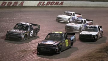 ROSSBURG, OH - JULY 18: Norm Benning, driver of the #6 Zomongo/H&H Transport Chevrolet, leads a pack of trucks during the NASCAR Camping World Truck Series Eldora Dirt Derby at Eldora Speedway on July 18, 2018 in Rossburg, Ohio. (Photo by Matt Sullivan/Getty Images)