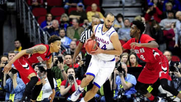 Mar 17, 2016; Des Moines, IA, USA; Kansas Jayhawks forward Perry Ellis (34) drives to the basket against Austin Peay Governors forward Kenny Jones (42) during the first half in the first round of the 2016 NCAA Tournament at Wells Fargo Arena. Mandatory Credit: Jeffrey Becker-USA TODAY Sports