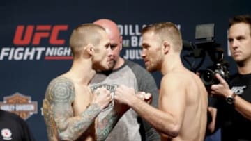 Jul 24, 2015; Chicago, IL, USA; Bryan Caraway (right) and Eddie Wineland (left) during weigh ins for UFC Fight Night at United Center. Mandatory Credit: Kamil Krzaczynski-USA TODAY Sports
