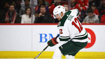 CHICAGO, IL - DECEMBER 27: Eric Staal #12 of the Minnesota Wild controls the puck against the Chicago Blackhawks at the United Center on December 27, 2018 in Chicago, Illinois. The Blackhawks defeated the Wild 5-2. (Photo by Jonathan Daniel/Getty Images)