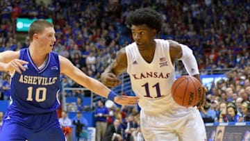 Nov 25, 2016; Lawrence, KS, USA; Kansas Jayhawks guard Josh Jackson (11) dribbles the ball as North Carolina-Asheville Bulldogs guard Kevin Vannatta (10) defends during the second half at Allen Fieldhouse. Kansas won 95-57. Mandatory Credit: Denny Medley-USA TODAY Sports