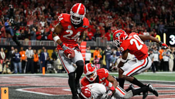 ATLANTA, GA - JANUARY 08: Dominick Sanders #24 of the Georgia Bulldogs fails to make an interception in bounds after breaking up a touchdown pass intended for Jerry Jeudy #4 of the Alabama Crimson Tide during the second half in the CFP National Championship presented by AT&T at Mercedes-Benz Stadium on January 8, 2018 in Atlanta, Georgia. (Photo by Jamie Squire/Getty Images)
