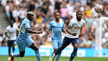 LONDON, ENGLAND - AUGUST 15: Japhet Tanganga of Tottenham Hotspur battles for possession with Benjamin Mendy of Manchester City during the Premier League match between Tottenham Hotspur and Manchester City at Tottenham Hotspur Stadium on August 15, 2021 in London, England. (Photo by Michael Regan/Getty Images)